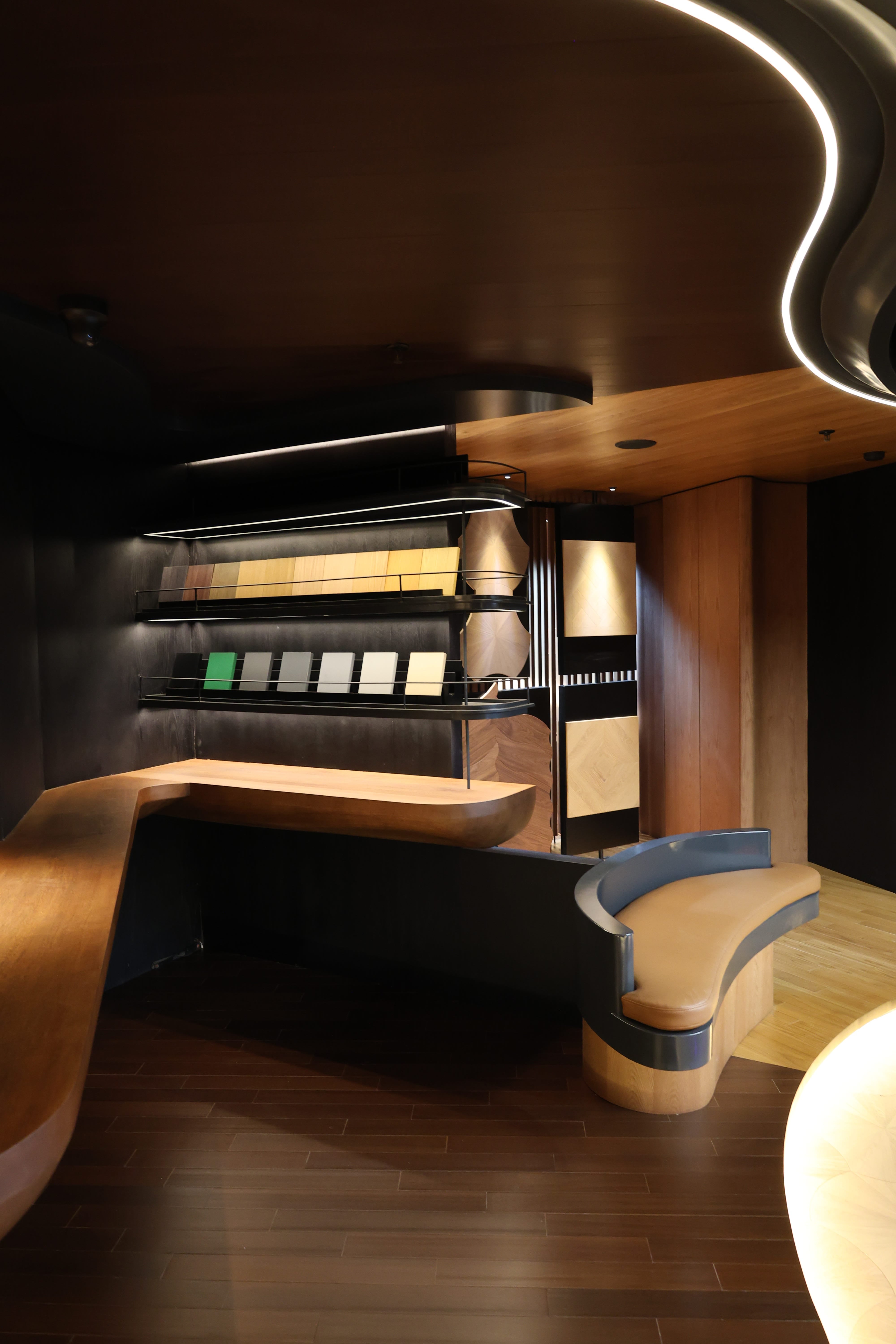 Consultation desk with wood sample swatches and chairs at Reywood Indonesia showroom