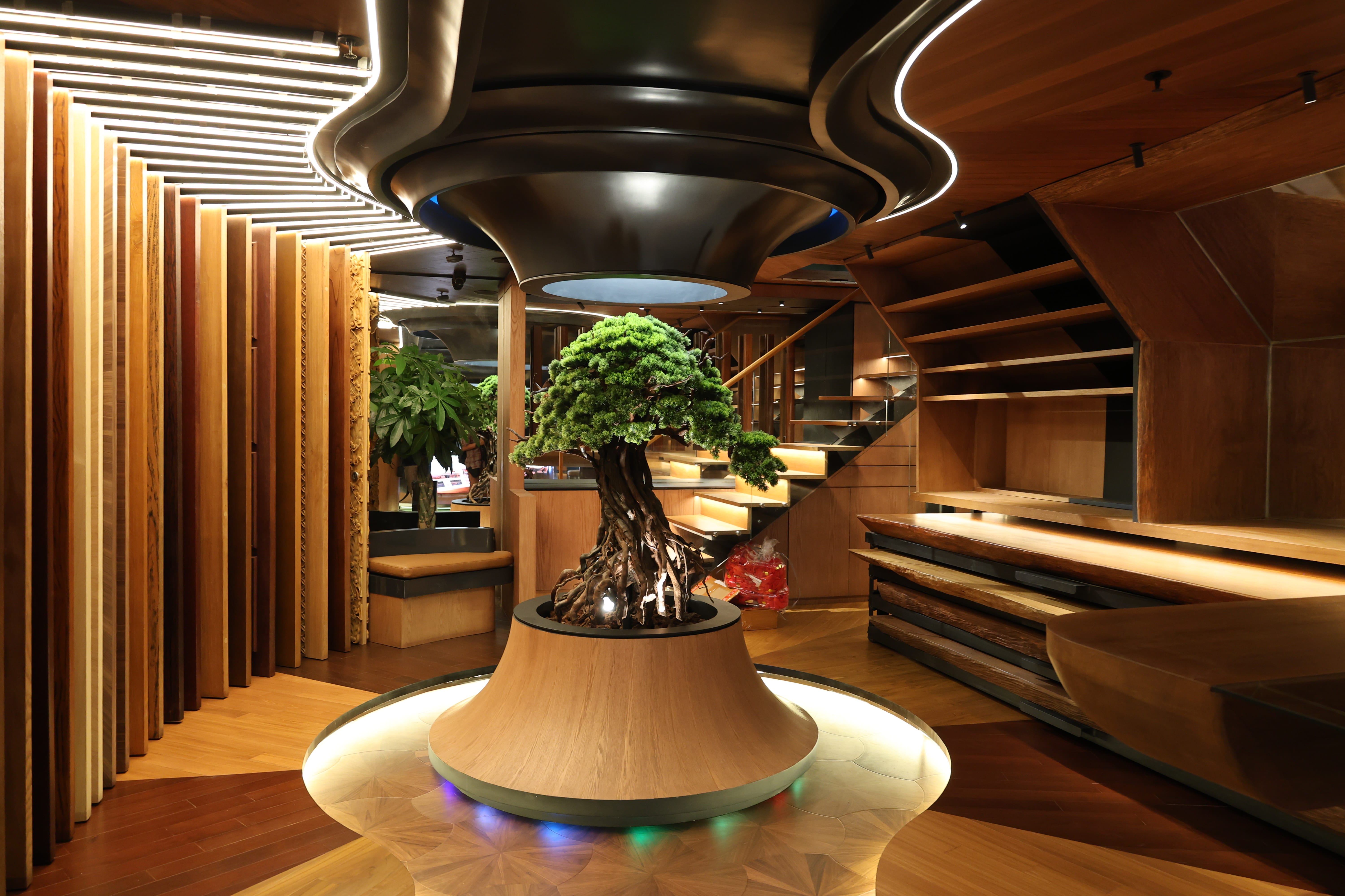 Reywood Indonesia showroom interior with wood panel displays and staircase Jakarta