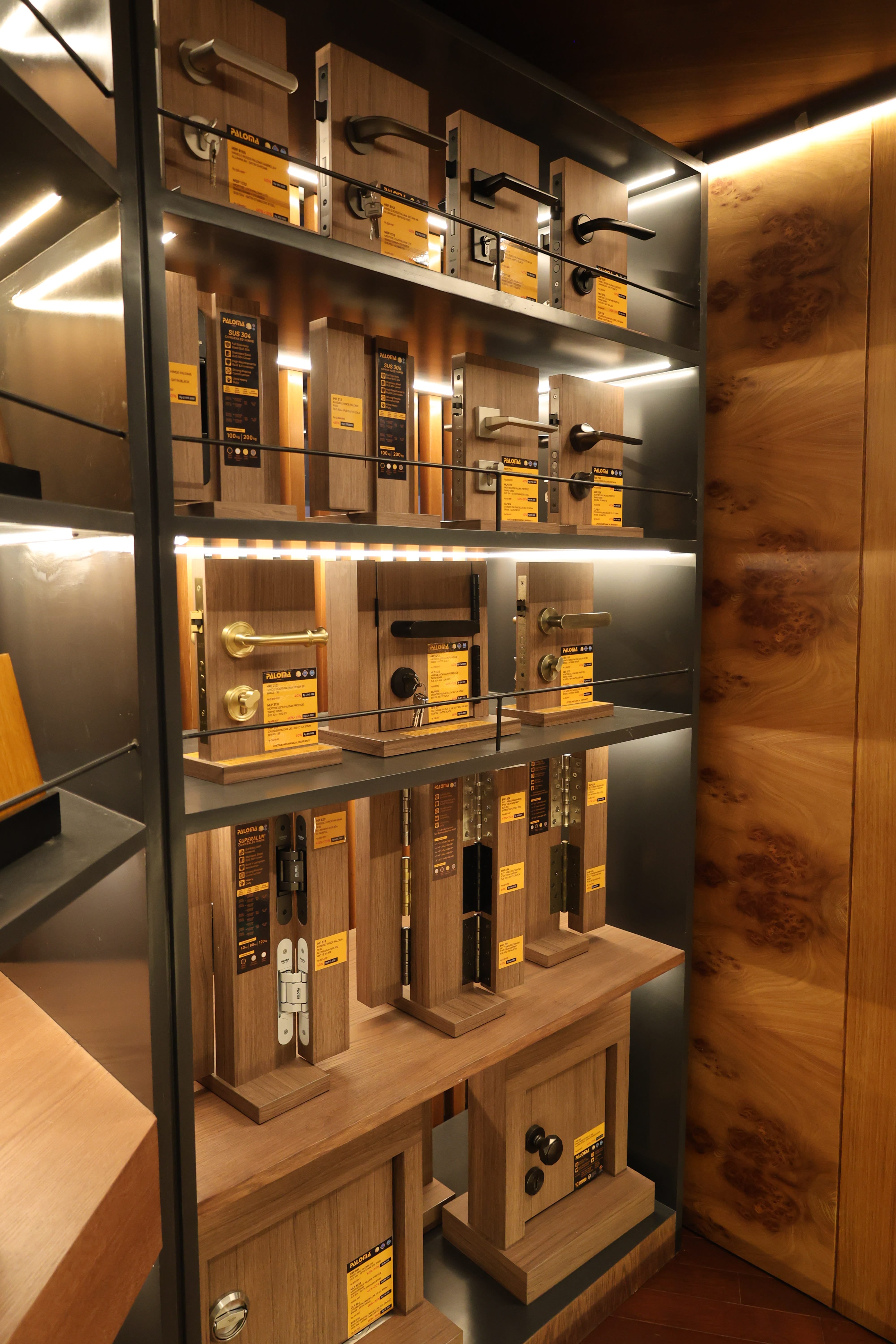 Glass display case with wood finish products and hardware at Reywood Indonesia showroom
